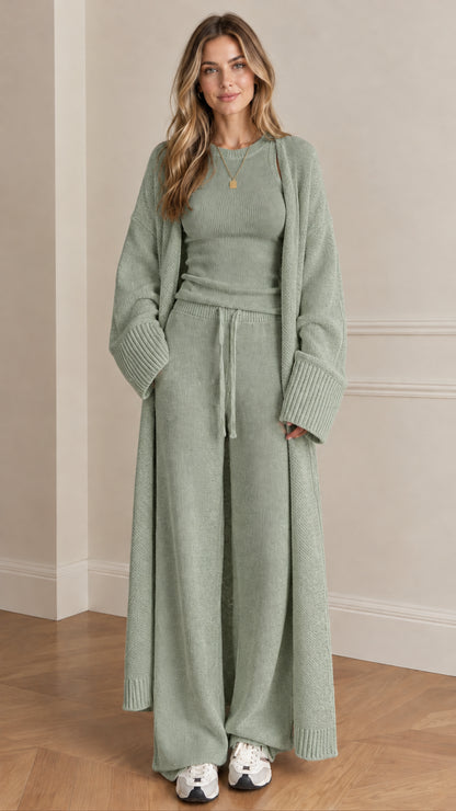 Front view of woman wearing sage green 3-piece knit lounge set with maxi cardigan