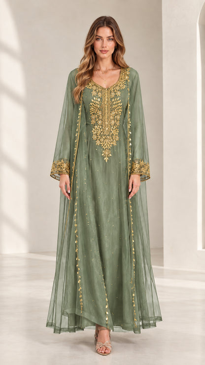 Front view of woman wearing sage green embroidered kaftan maxi dress with gold accents