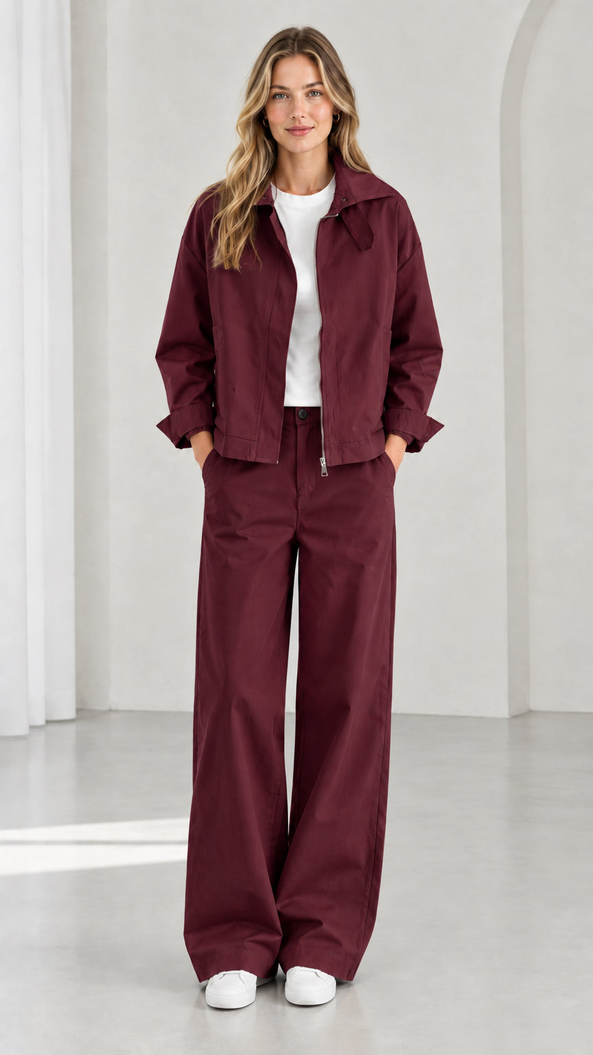 Full front view of women's burgundy utility zip jacket and wide-leg pants set