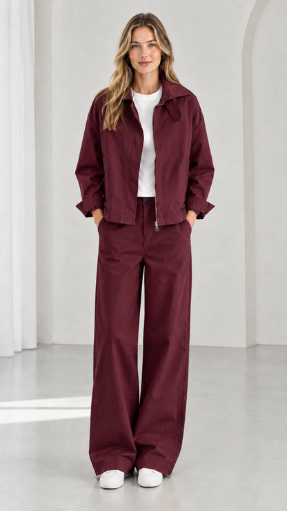 Full front view of women's burgundy utility zip jacket and wide-leg pants set