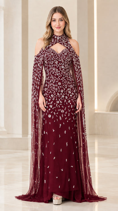 Full-length view of burgundy red sequined formal gown with cape sleeves