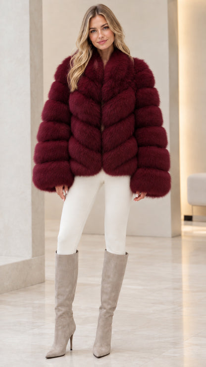 Model wearing rich burgundy wine red faux fur jacket with tall beige boots