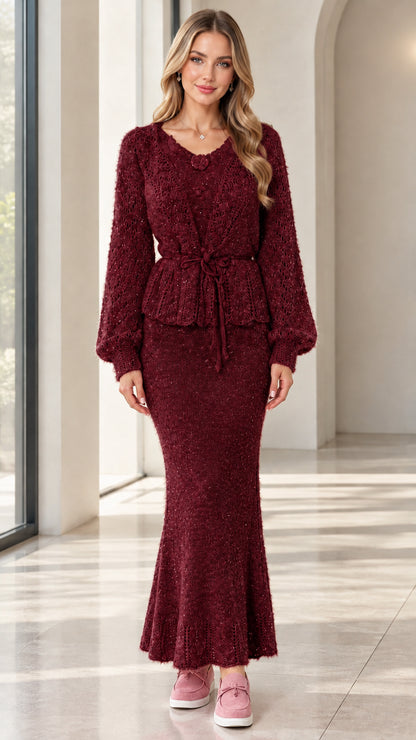 Woman wearing burgundy red knit peplum cardigan and long skirt co-ord set