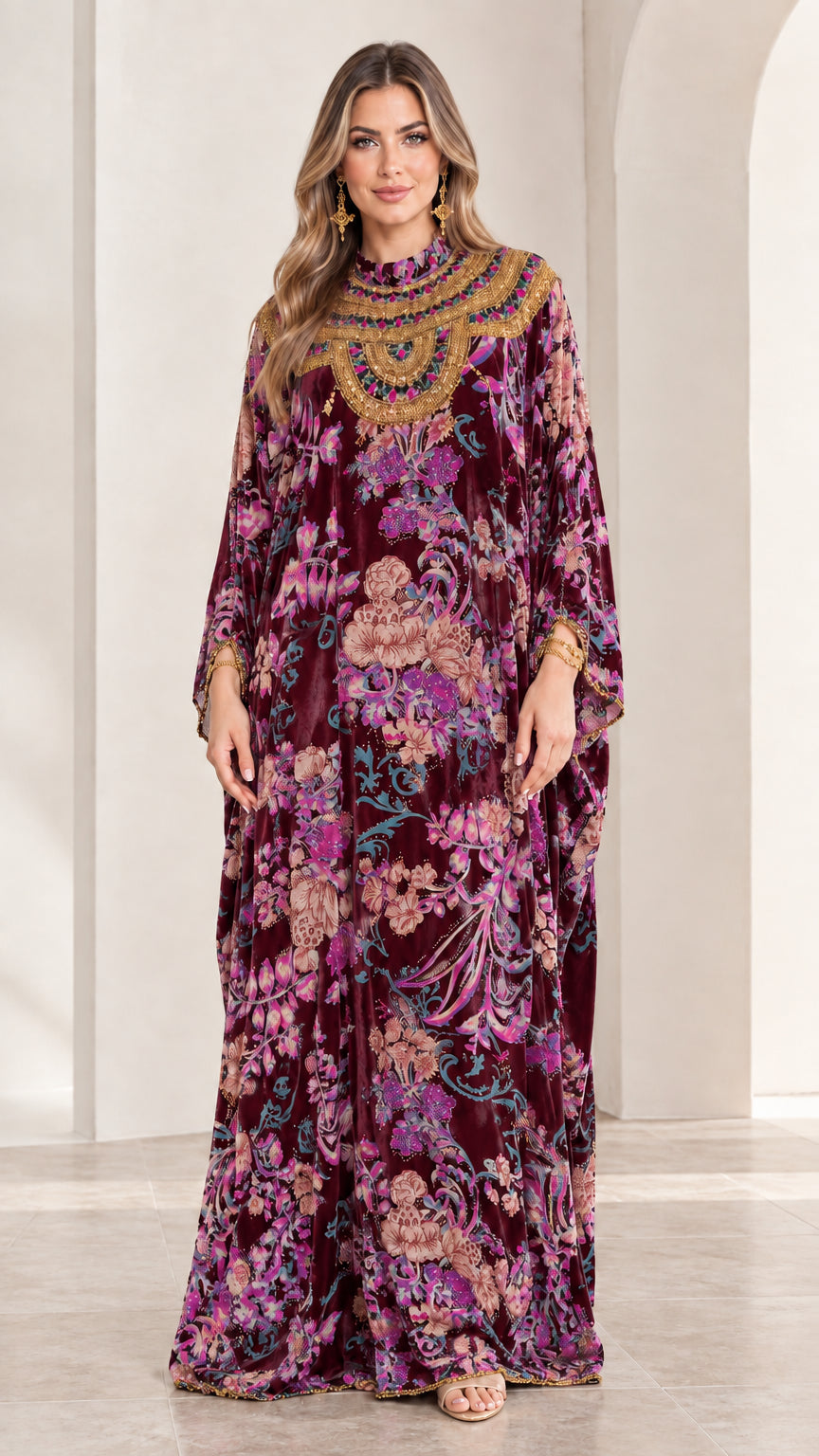 Front view of model wearing Burgundy floral velvet embellished kaftan maxi dress