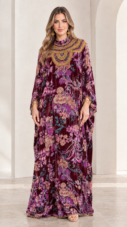 Front view of model wearing Burgundy floral velvet embellished kaftan maxi dress