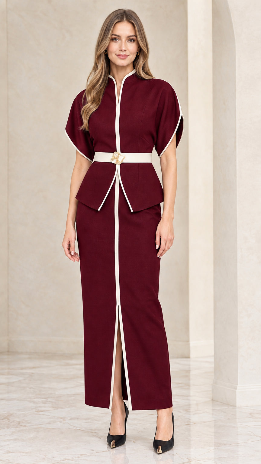 Front view of model wearing burgundy wine two-piece peplum top and maxi skirt set with white trim