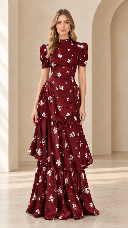 Model wearing burgundy floral print puff sleeve tiered maxi dress