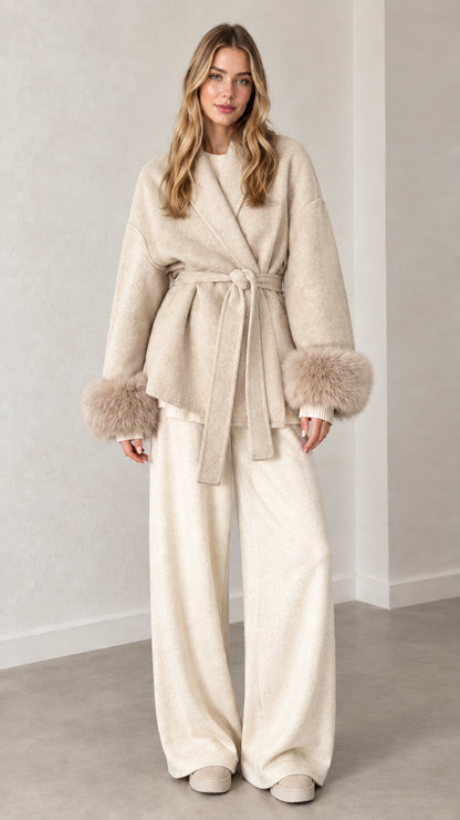 Front view of cream oatmeal belted short wrap coat with faux fur cuffs