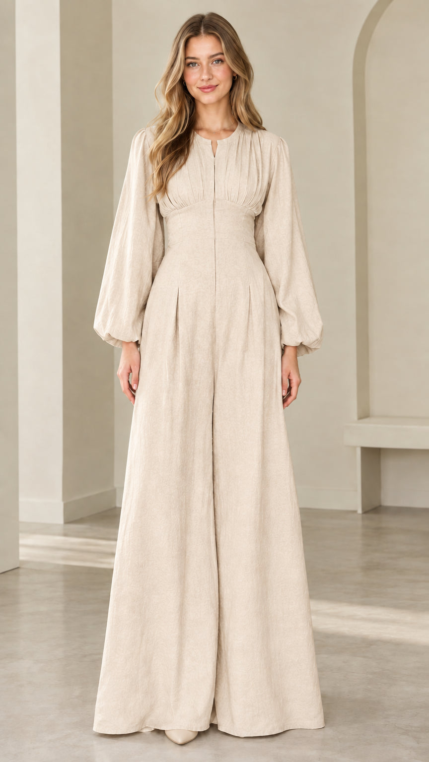 Model wearing cream beige lantern sleeve wide leg jumpsuit